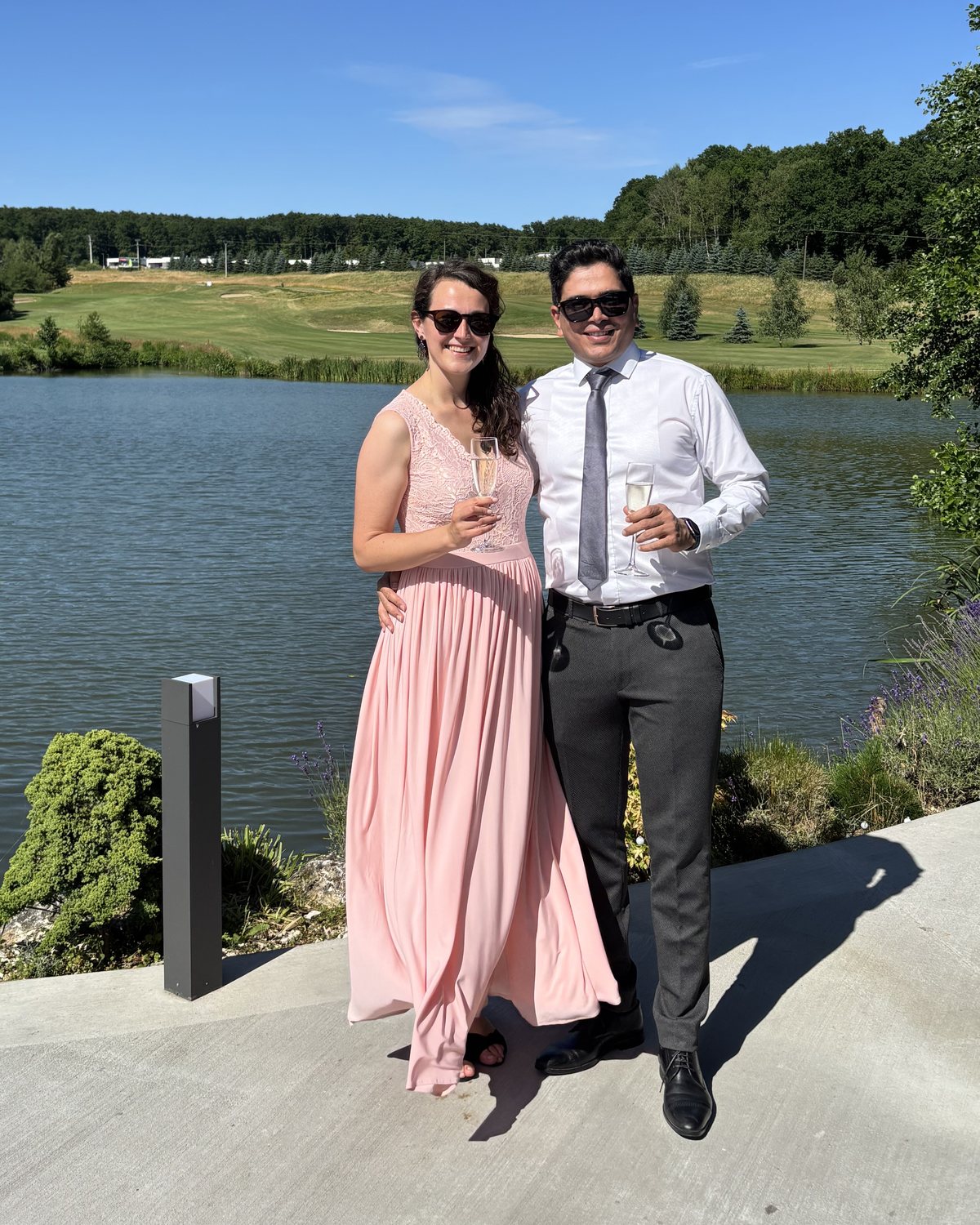 Katarina and Mostafa standing by a lake